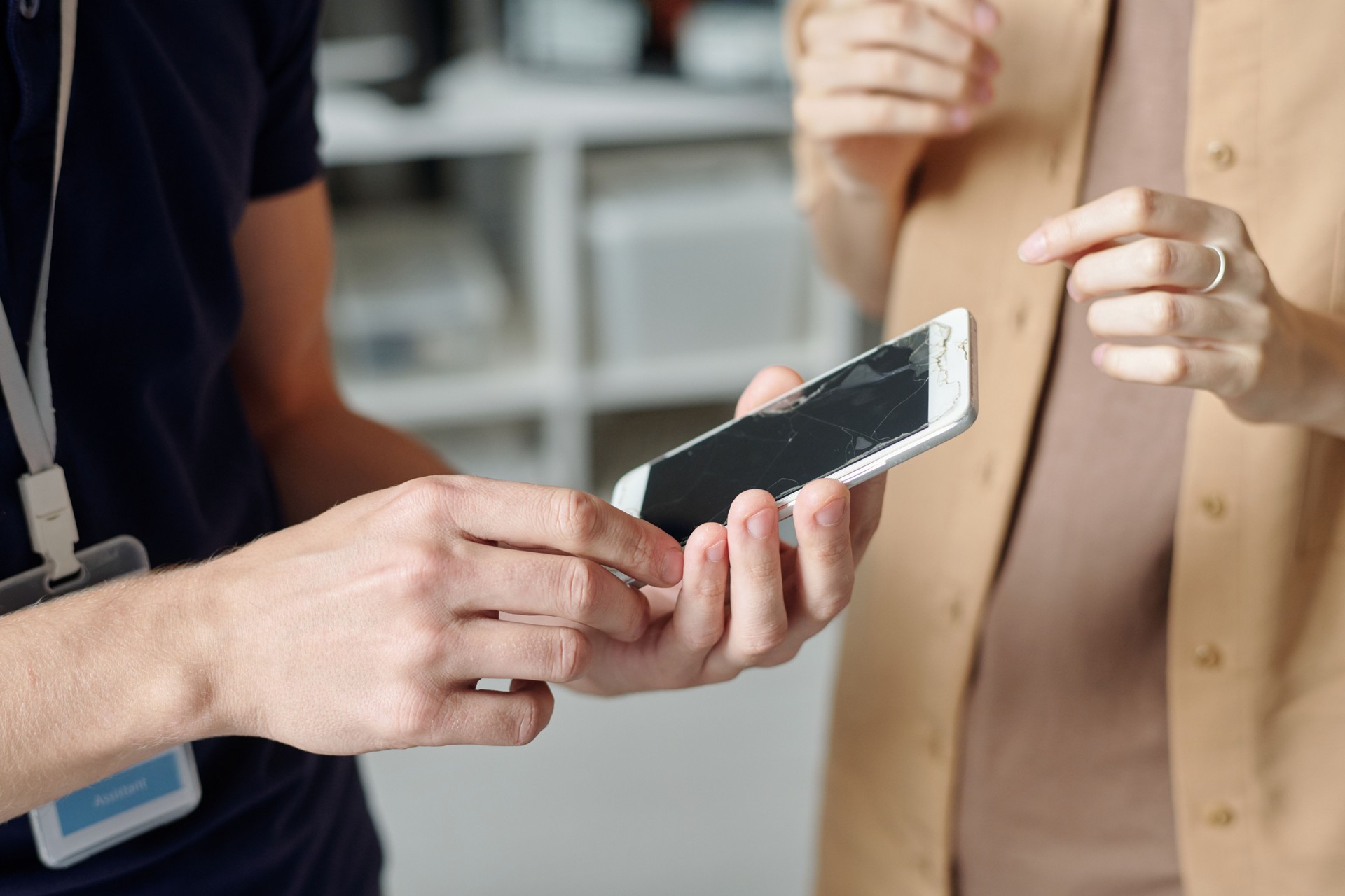 Technician holding broken mobile gadget